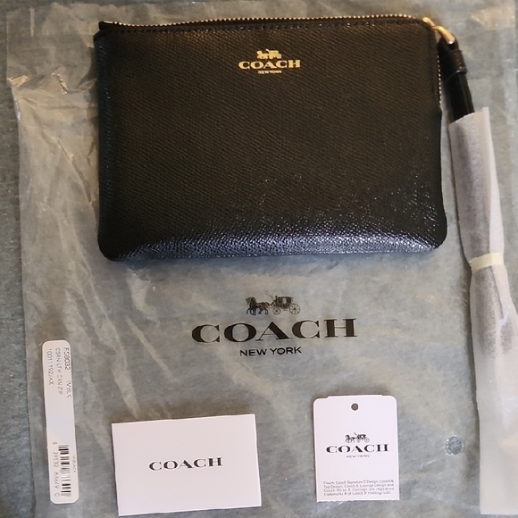 Coach Handbags - Coach Black Textured Leather Pouch